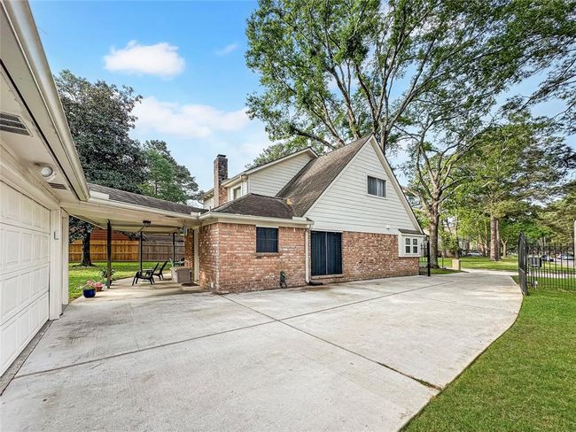 Extended driveway with automatic gate. | Image 26