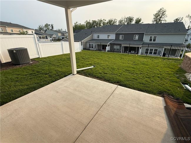 View of patio / terrace featuring central AC and a residential view | Image 25