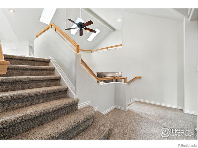 An open stairway leads to the large top-level loft. | Image 16