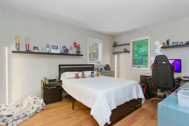 The first floor bedroom with hardwood floors. | Image 13