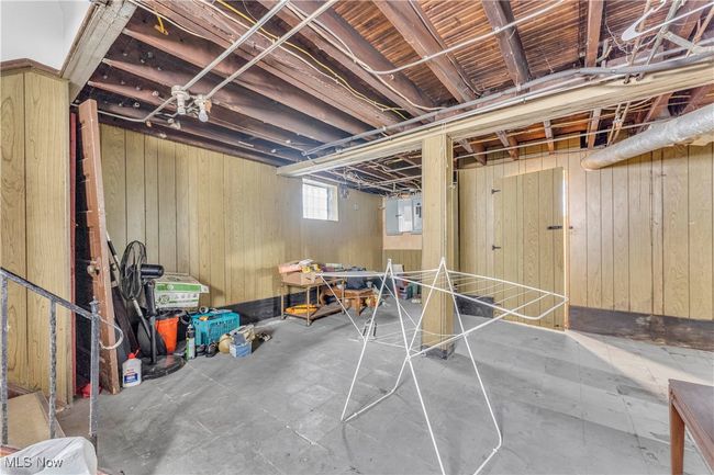 Basement featuring wood walls | Image 22