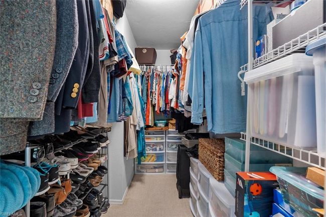 Spacious closet with carpet flooring | Image 26