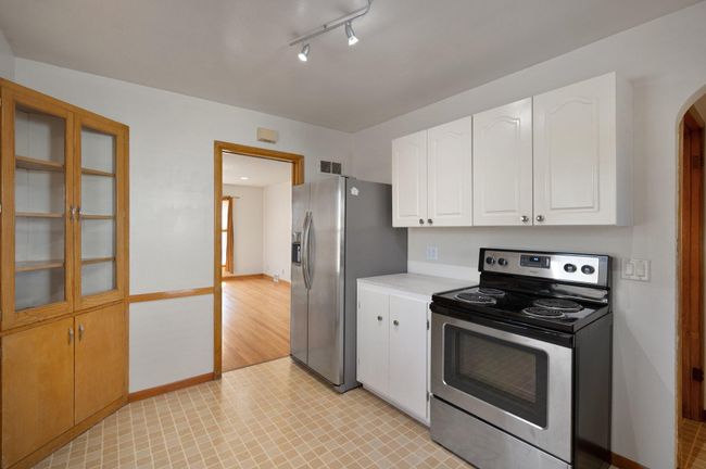 Kitchen with updated stainless steel appliances | Image 9