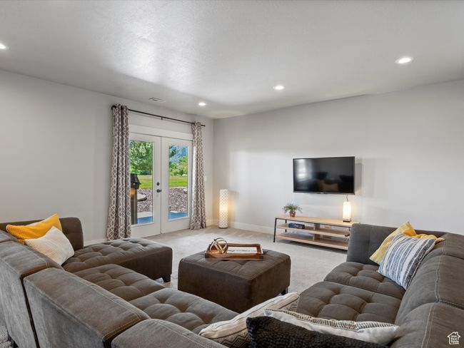 Living area featuring carpet, recessed lighting, french doors, and baseboards | Image 47