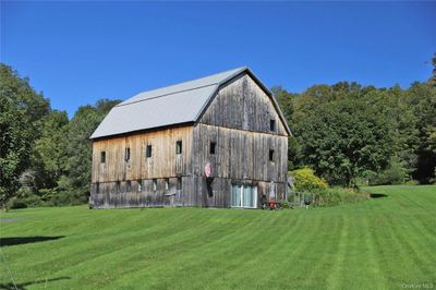 View of outbuilding featuring a lawn | Image 2