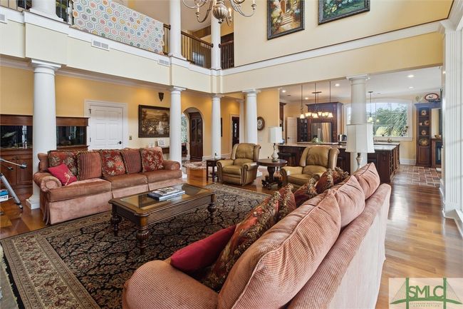 This area, encompassing the family room and the kitchen is the heart of the home. | Image 9