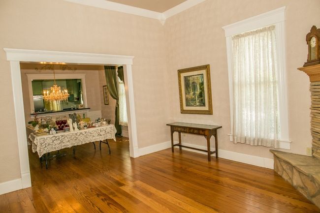 Sitting room featuring a chandelier, wood-type flooring, and crown molding | Image 11