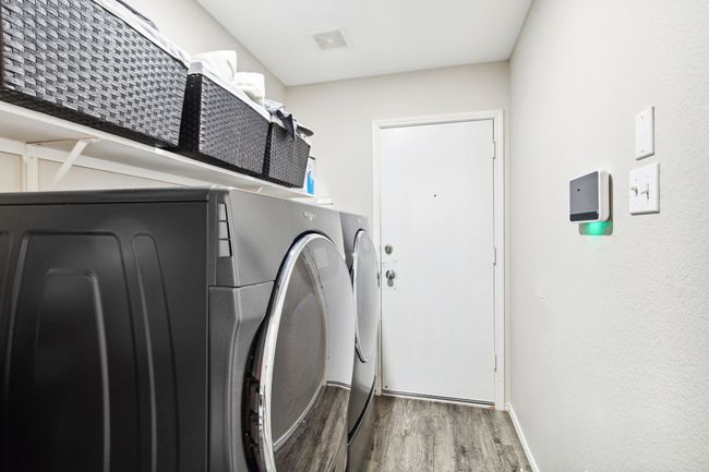 Laundry area leads to garage and is located just off the kitchen | Image 18