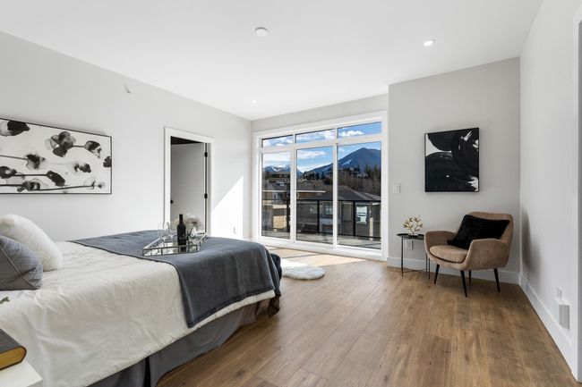 Bedroom with wood finished floors, access to outside, baseboards, a mountain view, and recessed lighting | Image 14