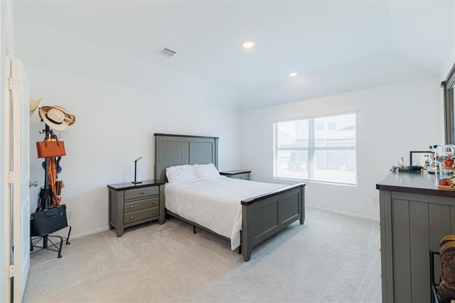 The serene primary suite offers an ensuite bath. | Image 10