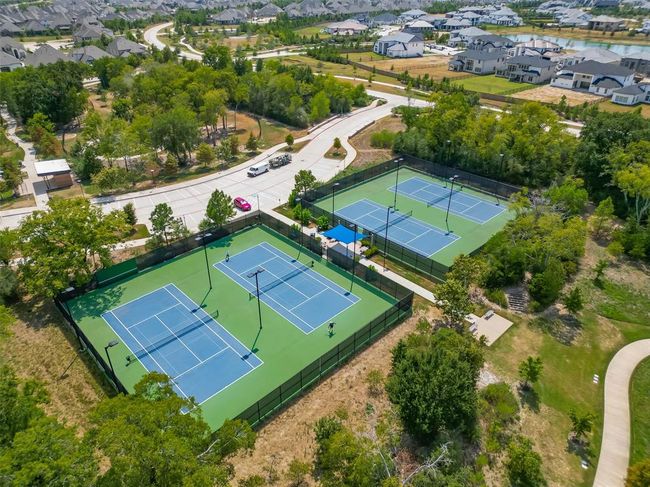 Features a single-family home with a spacious yard in Bridgeland, a master-planned community offering lakes, pools, sidewalks, and green spaces. | Image 30