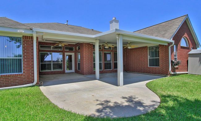 3 ceiling fans to keep cool and extended concrete so there is plenty of room for the BBQ pit | Image 32