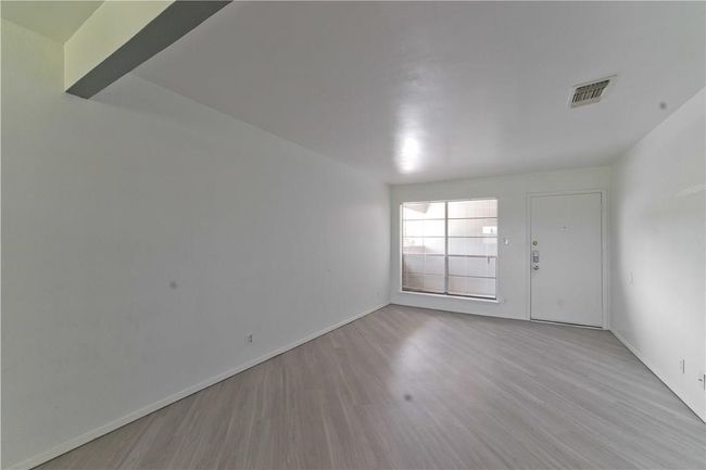 Unfurnished room with wood finished floors and baseboards | Image 5