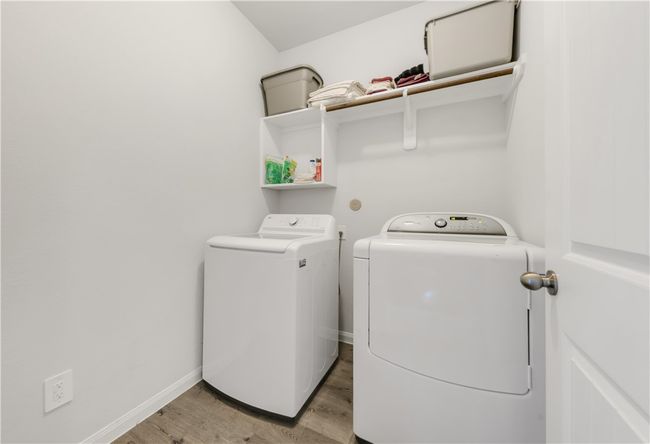 Laundry photo of a different house with the same floor plan and similar finishes. | Image 19