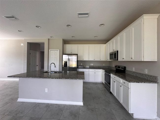 7309 Pool Compass Loop, House other with 4 bedrooms, 3 bathrooms and null parking in WESLEY CHAPEL FL | Image 7