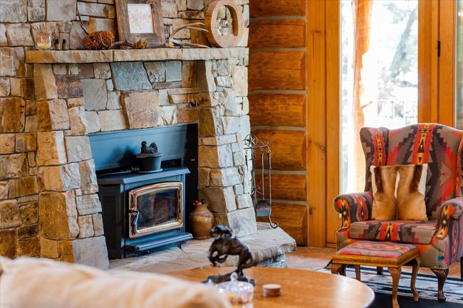 Main level living area. Custom stone fireplace. | Image 40