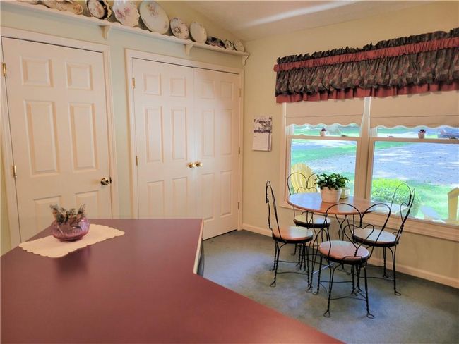 Pantry on left and washer/dryer behind doors on the right | Image 15