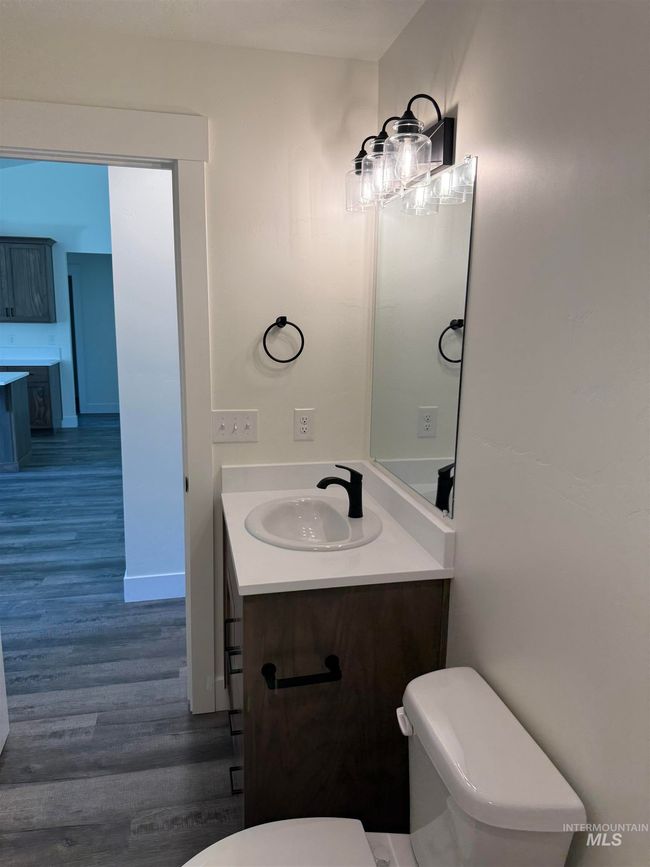 Bathroom with wood finished floors and vanity | Image 10