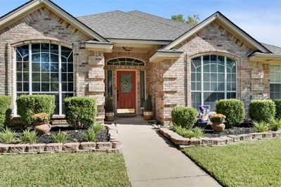 Property entrance featuring a lawn | Image 3