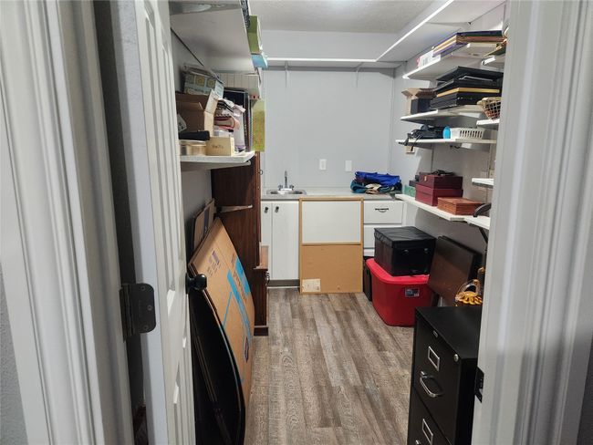 Large walk-in storage closet. Originally designed as a bar with a sink. | Image 35
