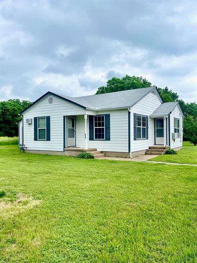 Ranch-style home featuring a front lawn | Image 2