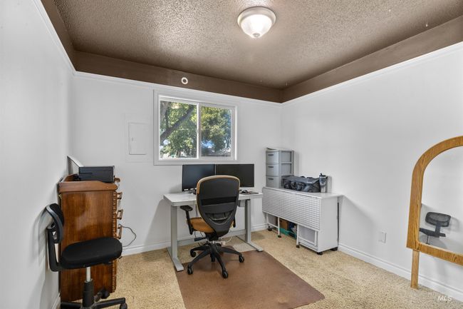 Office area featuring a textured ceiling and carpet | Image 21