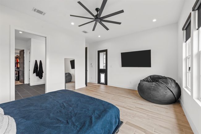 Bedroom featuring recessed lighting, visible vents, and wood finished floors | Image 23