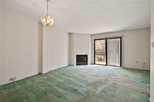 Livingroom has access to rear deck. | Image 4