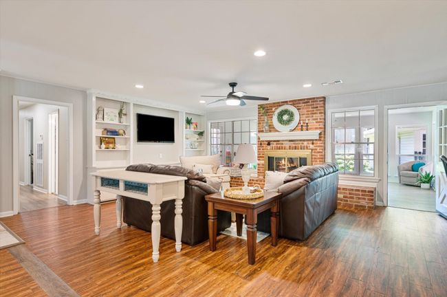 Immaculate, well kept family room adjoins the sunroom | Image 15