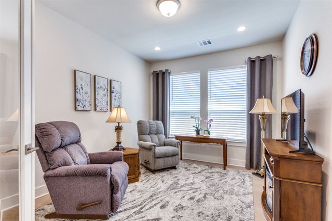 Sitting room featuring light wood finished floors and recessed lighting | Image 7