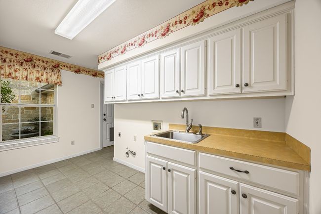 Conveniently located with direct access to the garage and the kitchen. | Image 18