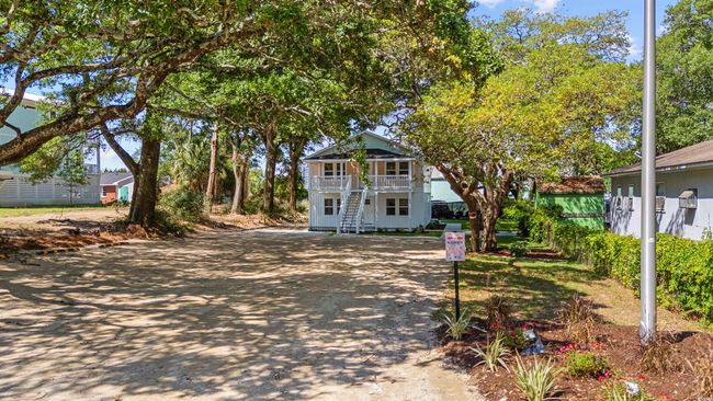 View of front of house with a balcony, driveway, and covered porch | Image 8