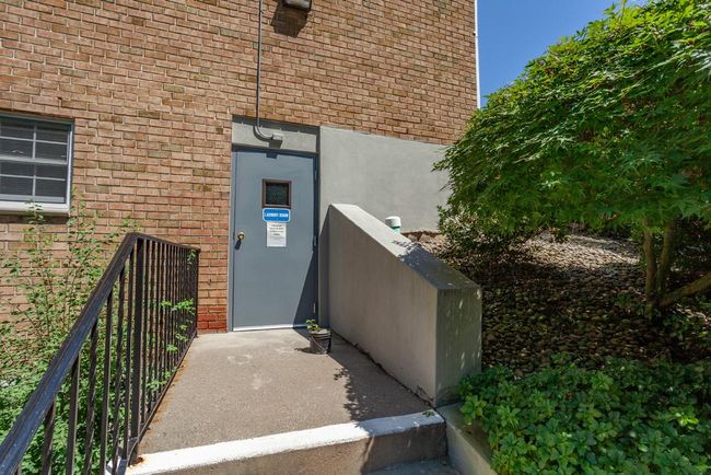 Entrance to laundry room featuring brick siding | Image 16