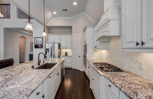 Gas cooktop with built-in vent hood. | Image 10