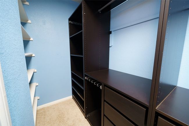 Spacious closet with carpet | Image 21