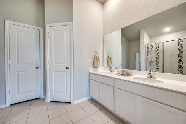Primary bath has walk in closet and double sinks | Image 13