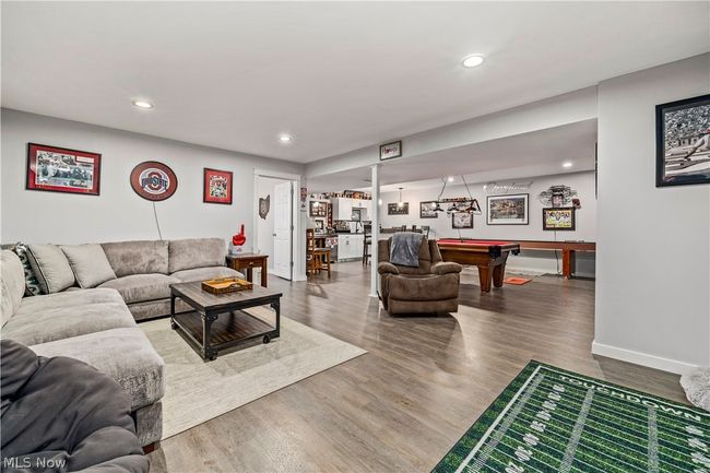 Living room with wood-type flooring and pool table | Image 33