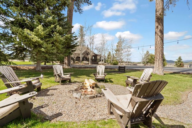 View of yard featuring an outdoor fire pit | Image 63