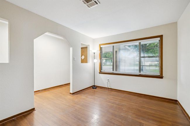 Formal living room with large window. Great for a family or receptionist (easy to see driveway and parking area) | Image 5