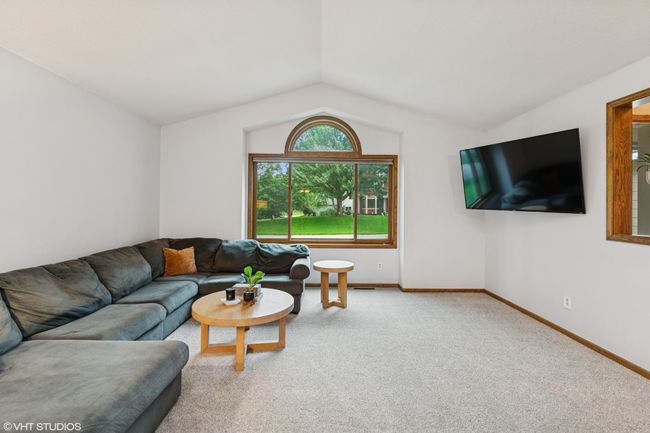 Bright and open family room featuring brand new carpet | Image 8