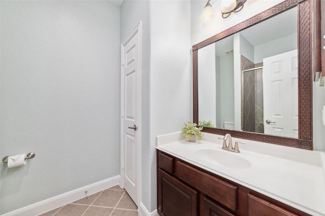 Full bathroom with walk in shower for the back bedroom and also accessible for guests. | Image 21