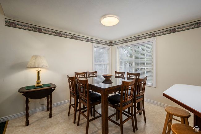 Dining room with baseboards | Image 21