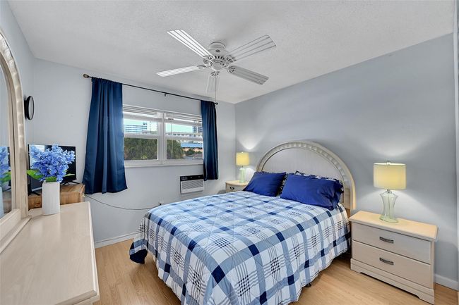 Your Furnished Guest Bedroom Includes This Queen Sized Bedroom Furniture. Wake up to Amazing Sunrises! Includes Impact Windows & Blinds, So Quiet! | Image 9