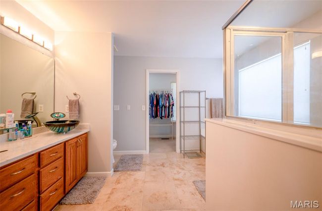 Full bath with vanity and a walk in closet | Image 28