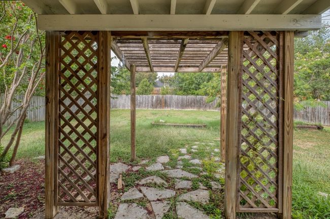Fenced backyard featuring a pergola | Image 23