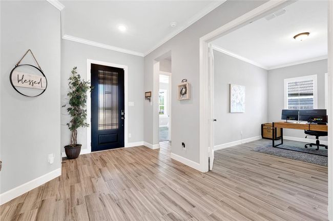 Upgraded flooring throughout home with private home office downstairs | Image 12