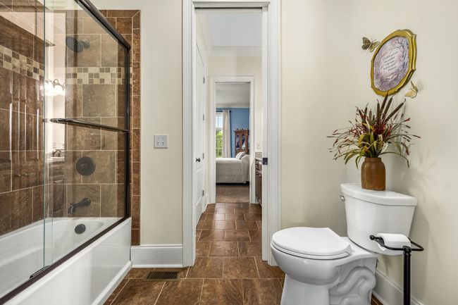Guest bath offers a tub and shower combination. | Image 51