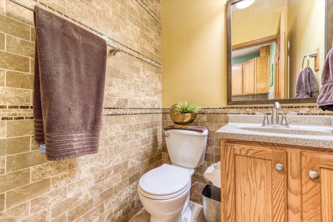 Main floor half bath located off laundry/garage entry/mud room | Image 22