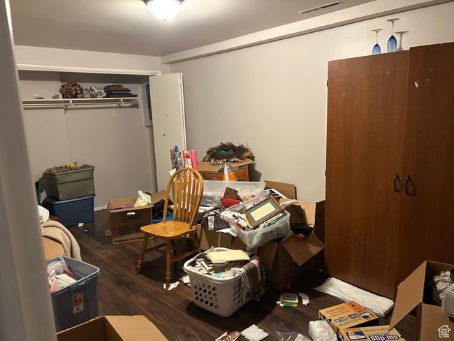 Bedroom with wood finished floors and a closet | Image 13