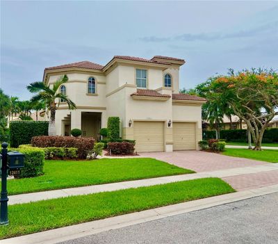 12411 Nw 57th St, House other with 5 bedrooms, 3 bathrooms and null parking in Coral Springs FL | Image 1